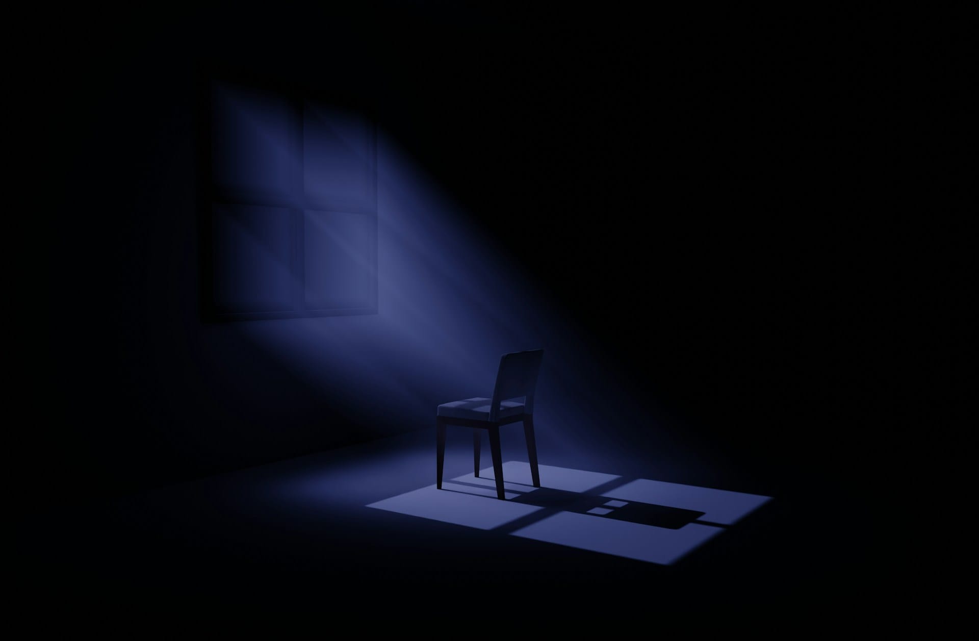 An empty chair illuminated by soft blue light through a window, symbolizing loneliness, reflection, and processing grief.