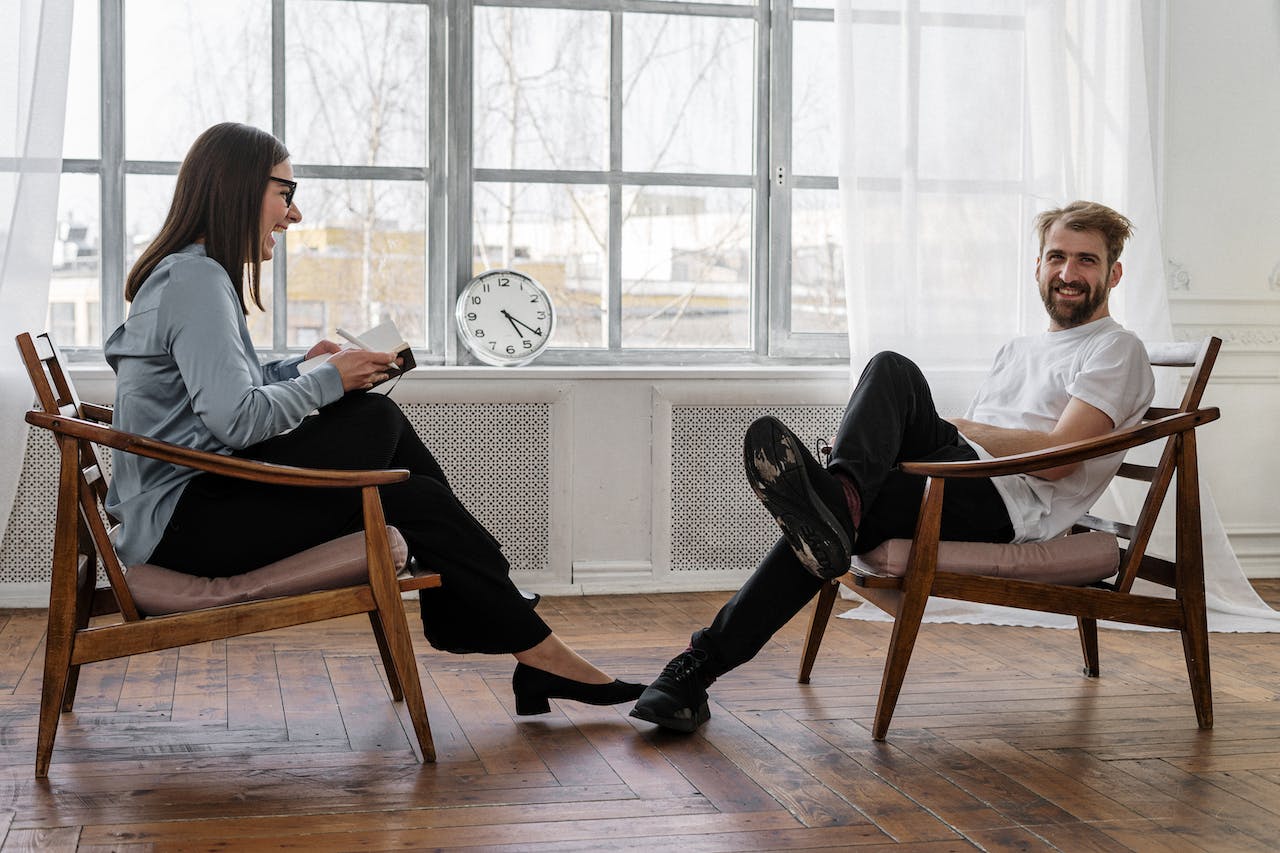 Person sitting on a therapist's couch during a session, representing ADHD therapy support for decision fatigue in seattle